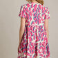 Umgee Full Size Abstract Print Pleat Detail Short Sleeve V-Neck Tiered Dress Plus Size