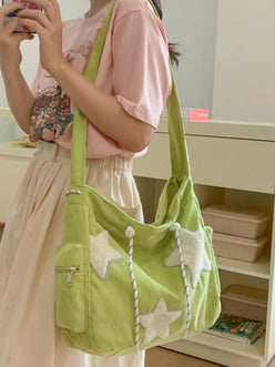 Lime green corduroy star applique hobo crossbody bag with striped drawstrings