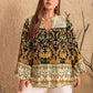 Plus size black floral print blouse with cream gold accents, lace collar, bell sleeves