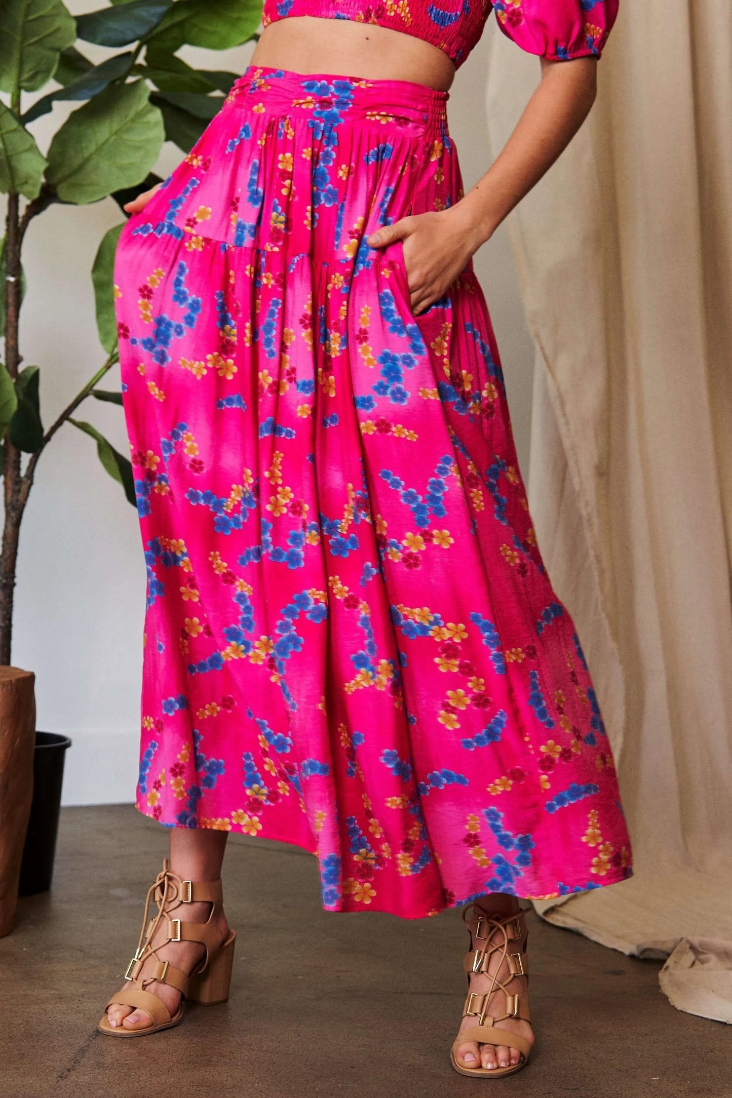 Vibrant pink Davi & Dani printed smocking waistband ruffled maxi skirt with blue and yellow accents