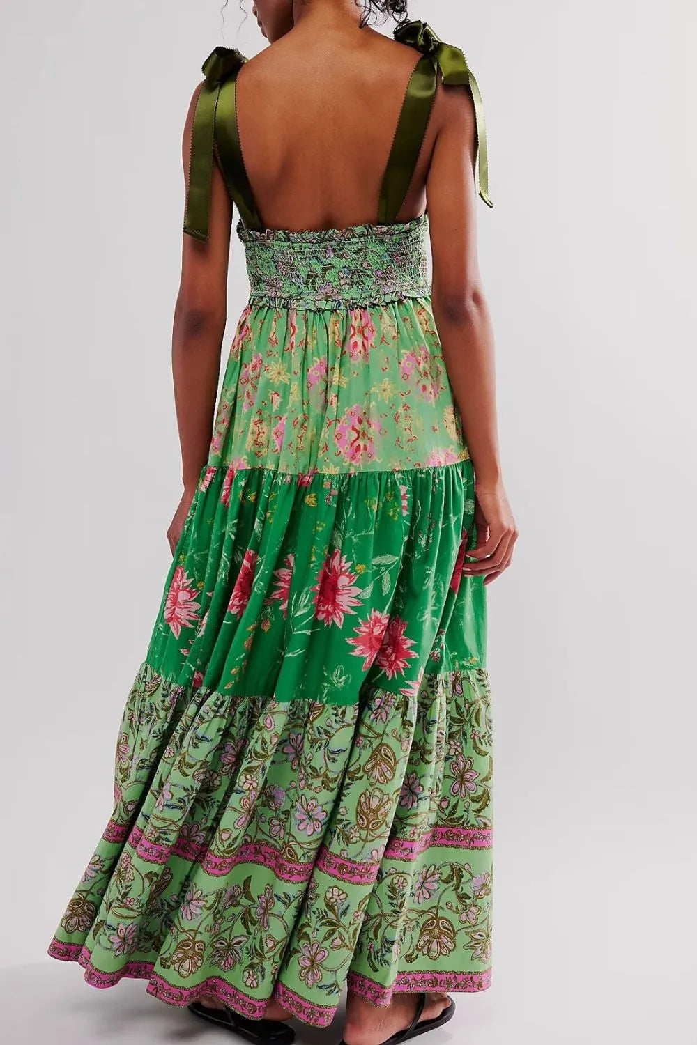 Floral tiered maxi dress in vibrant green with pink gold accents smocked waist