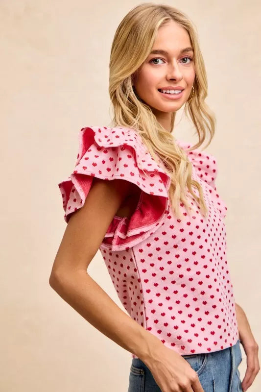 Pink polka-dot BiBi Heart patterned knit top with ruffled shoulder sleeves
