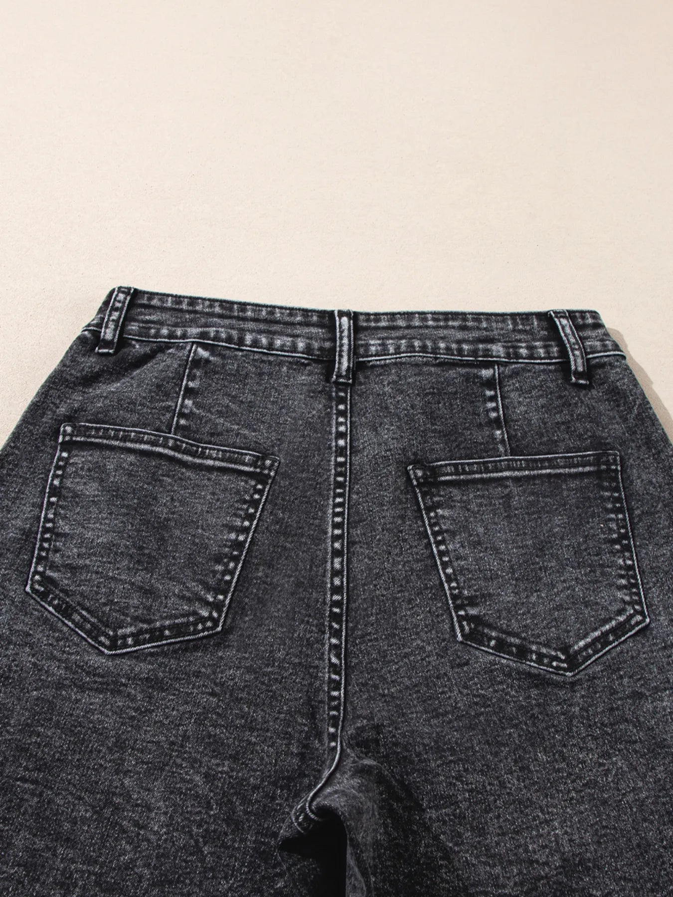 High-waisted wide leg dark gray denim jeans with white stitching