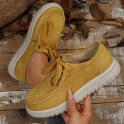 Mustard yellow suede lace-up round toe loafers with white soles