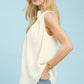 Umgee sleeveless textured split neck top in cream, relaxed flowing silhouette