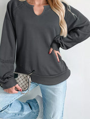 Charcoal gray oversized V-neck sweatshirt with black mesh panels
