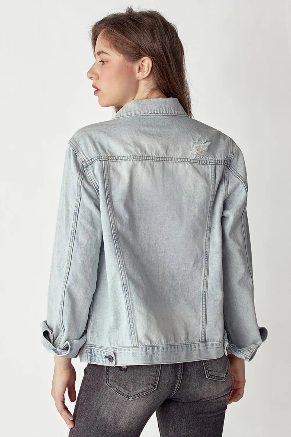 Light-wash RISEN Distressed Button Up Denim Jacket with embroidered crown patch