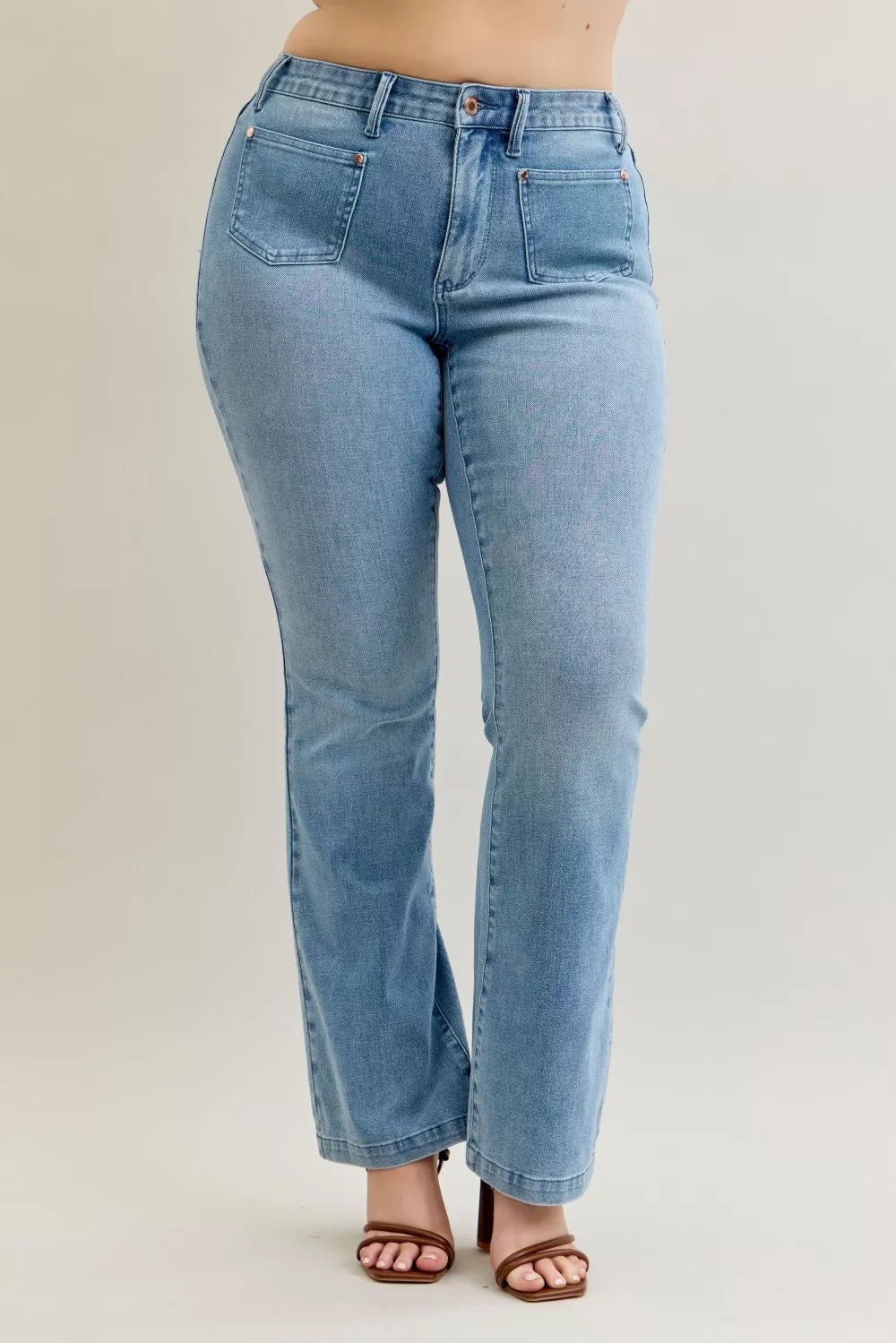 Light blue high-waisted Judy Blue mid-rise bootcut jeans with button fly