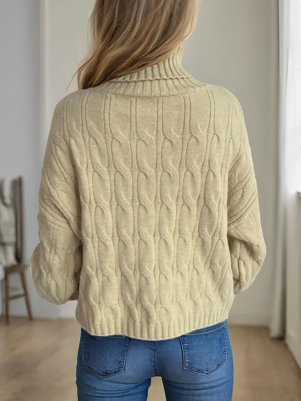 Cream cable-knit turtleneck sweater with ribbed cuffs and hem