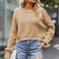 Beige oversized round neck drop shoulder knit sweater with ribbed cuffs