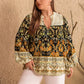 Plus size black floral print blouse with cream lace collar, cuffs, bell sleeves, V-neck