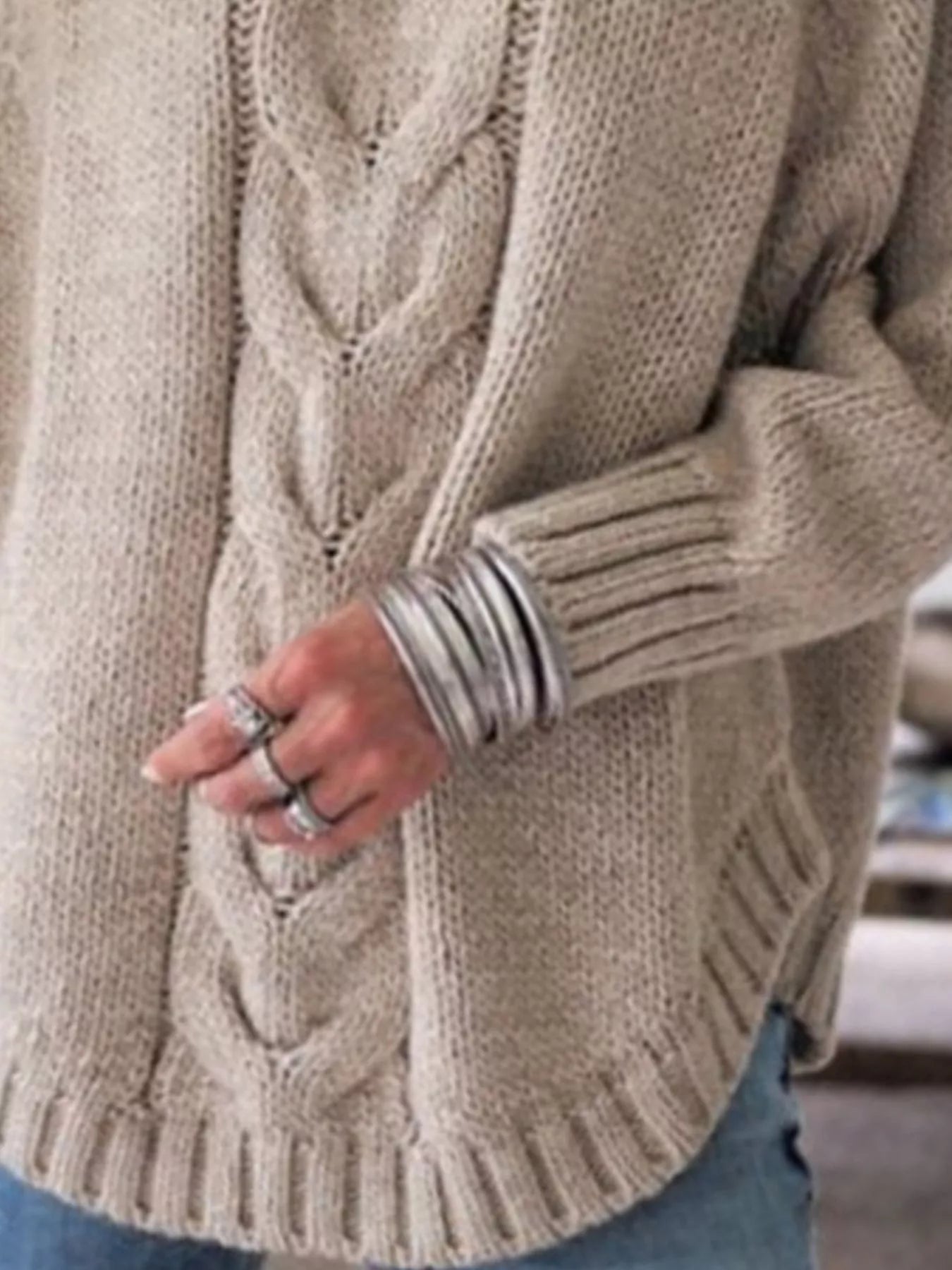 Cozy beige cable-knit long sleeve sweater with ribbed hem and cuffs