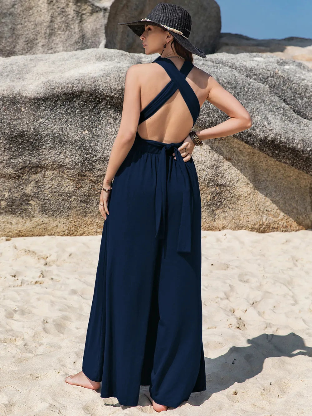 Navy blue surplice halter-neck jumpsuit with cross-back and wide-leg pants