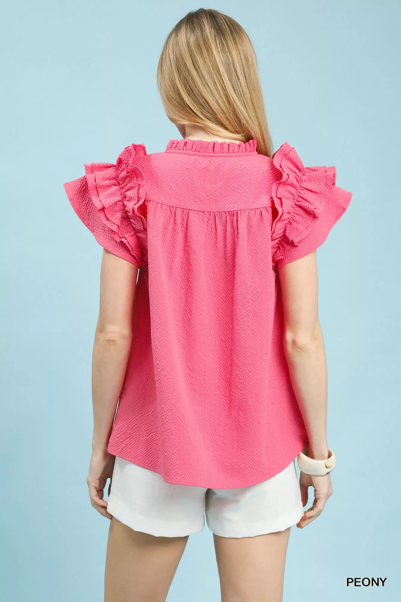 Umgee textured ruffle sleeve notched top in vibrant pink with gathered shoulders