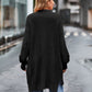 Black long sleeve waffle-knit cardigan with ribbed relaxed fit