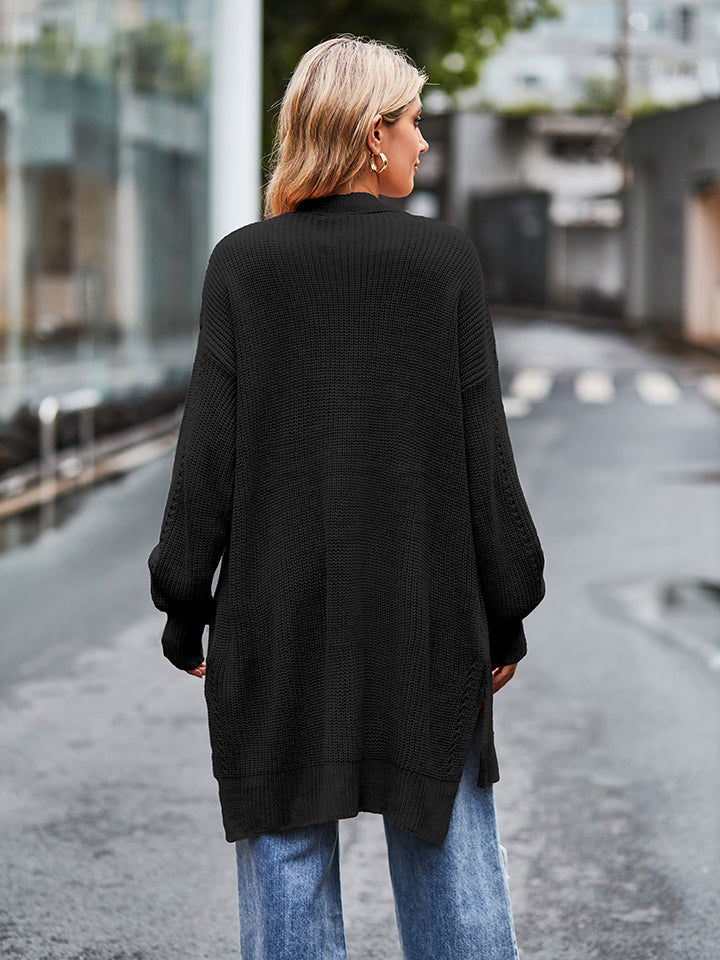 Black long sleeve waffle-knit cardigan with ribbed relaxed fit