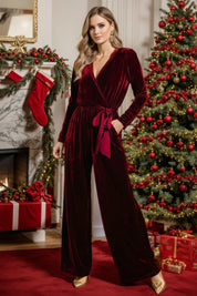 Burgundy velvet tie waist jumpsuit with gold accents