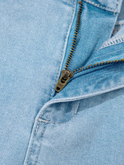 Light blue denim jacket with gold zipper on high rise jeans