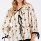 SAGE + FIG Bow Print Tie Front Babydoll Blouse - DAVERRI FASHIONS