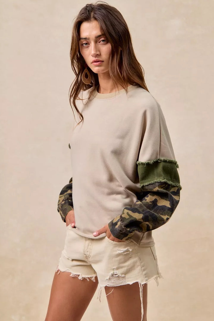BiBi Camo Sleeve French Terry Top with Frayed Edge | Daverri Fashions