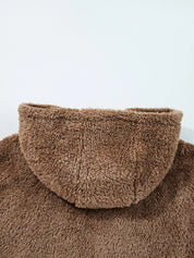 Brown fluffy turtleneck sweater with high collar and ribbed cuffs