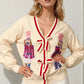 Double Take Full Size Nutcracker Sequin Bow Decor Cardigan - DAVERRI FASHIONS