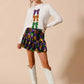 White long-sleeved sweater with purple, gold, green sequined bows for SO ME Mardi Gras skirt