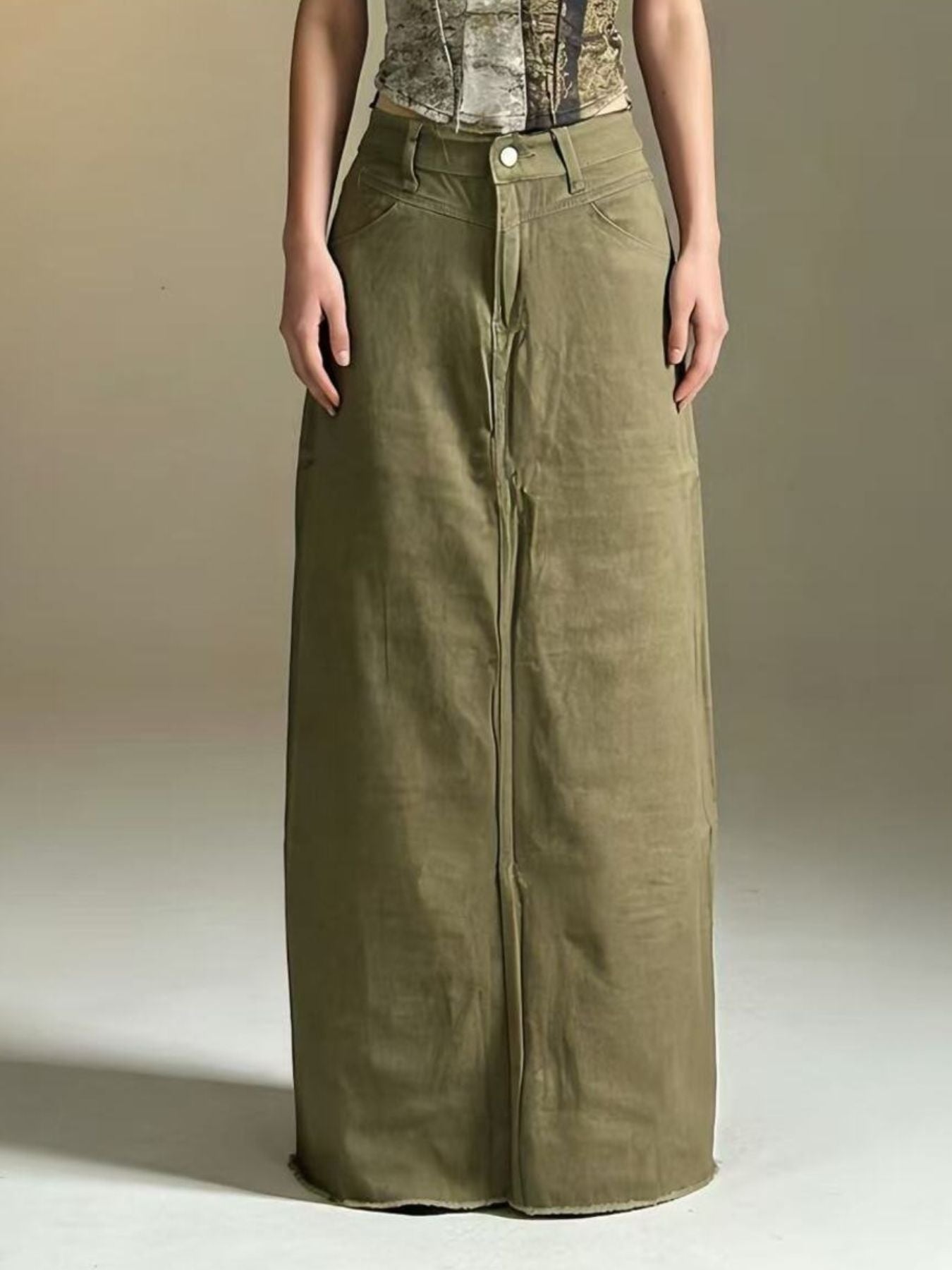 Raw hem maxi denim skirt in olive green with wide-leg straight front and button closure