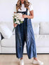 Daverri Distressed Wide Leg Denim Overalls in blue with distressed details