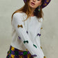 White SO ME Mardi Gras sweater with gold and purple sequined bows
