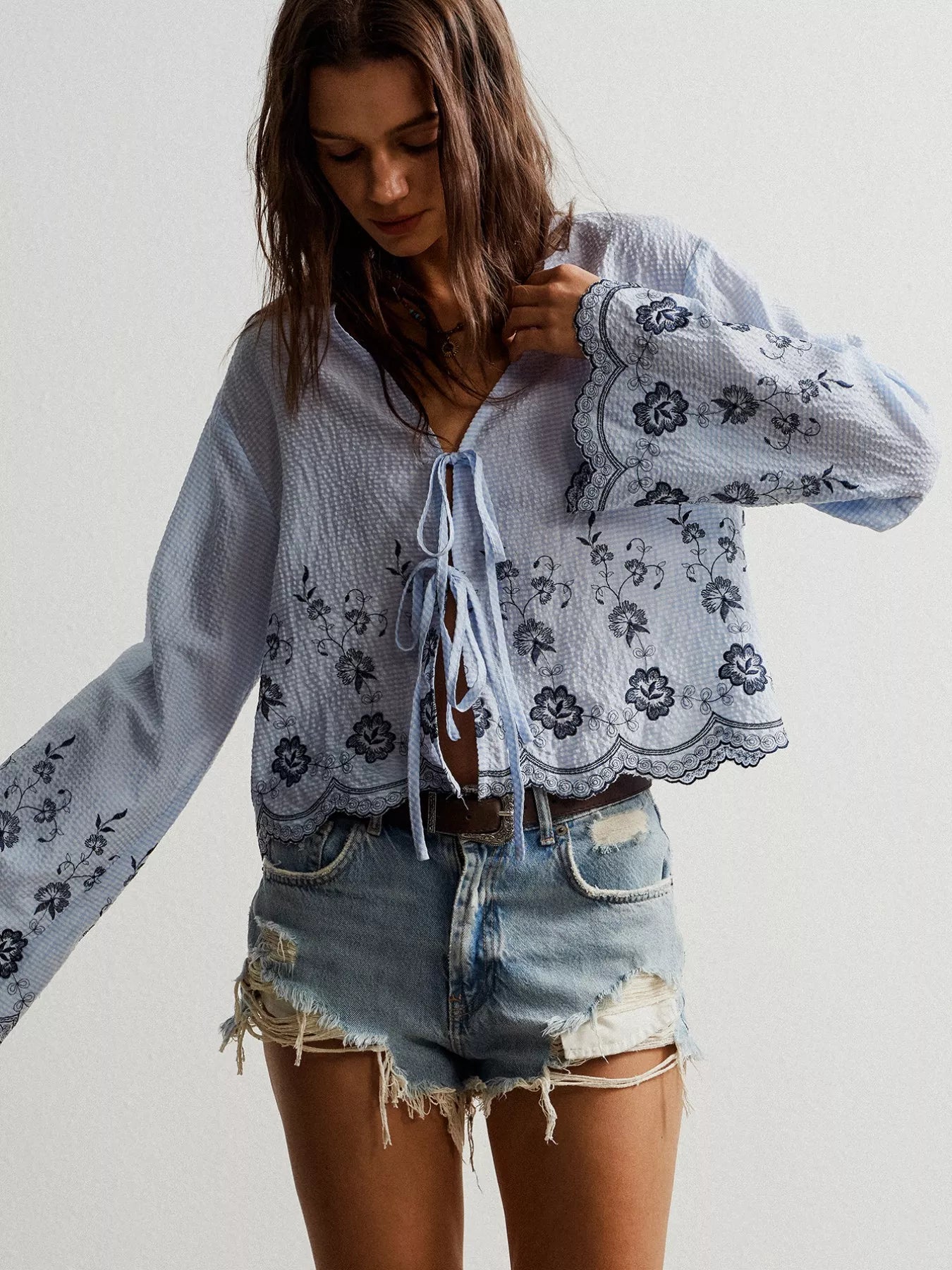 Blue and white floral embroidered tie-front blouse with lace-up detail