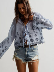 Blue and white floral embroidered tie-front blouse with lace-up detail