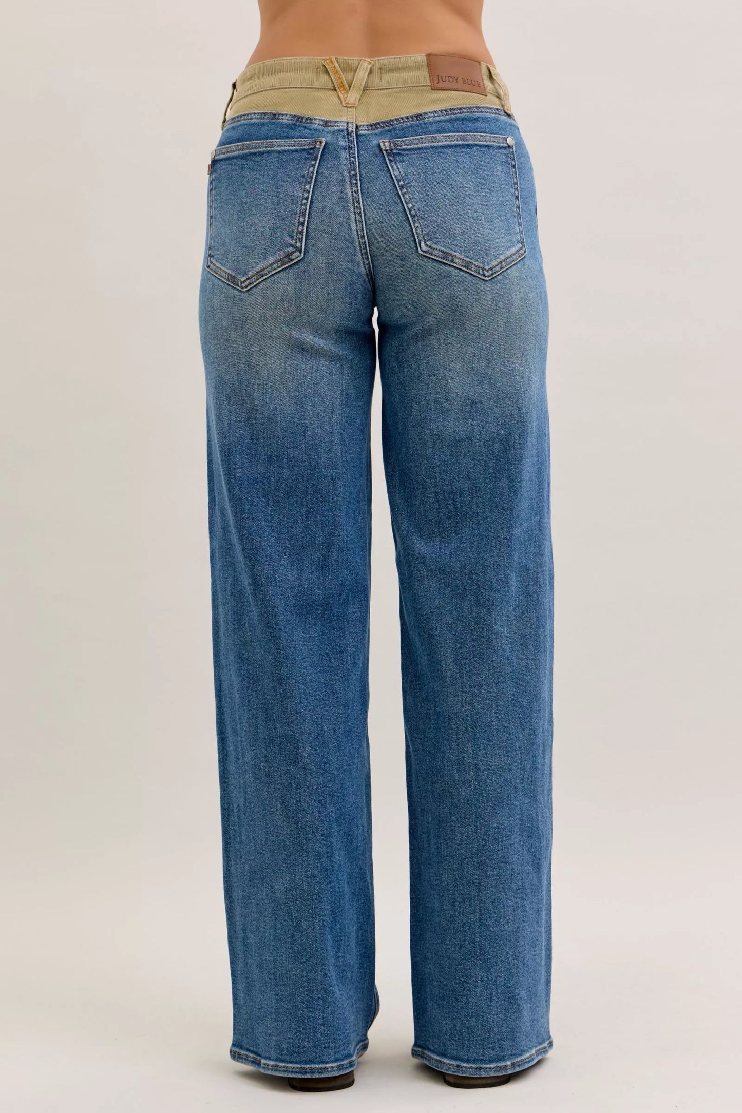 Judy Blue mid-rise straight jeans back: blue denim, beige waistband, brown leather patch