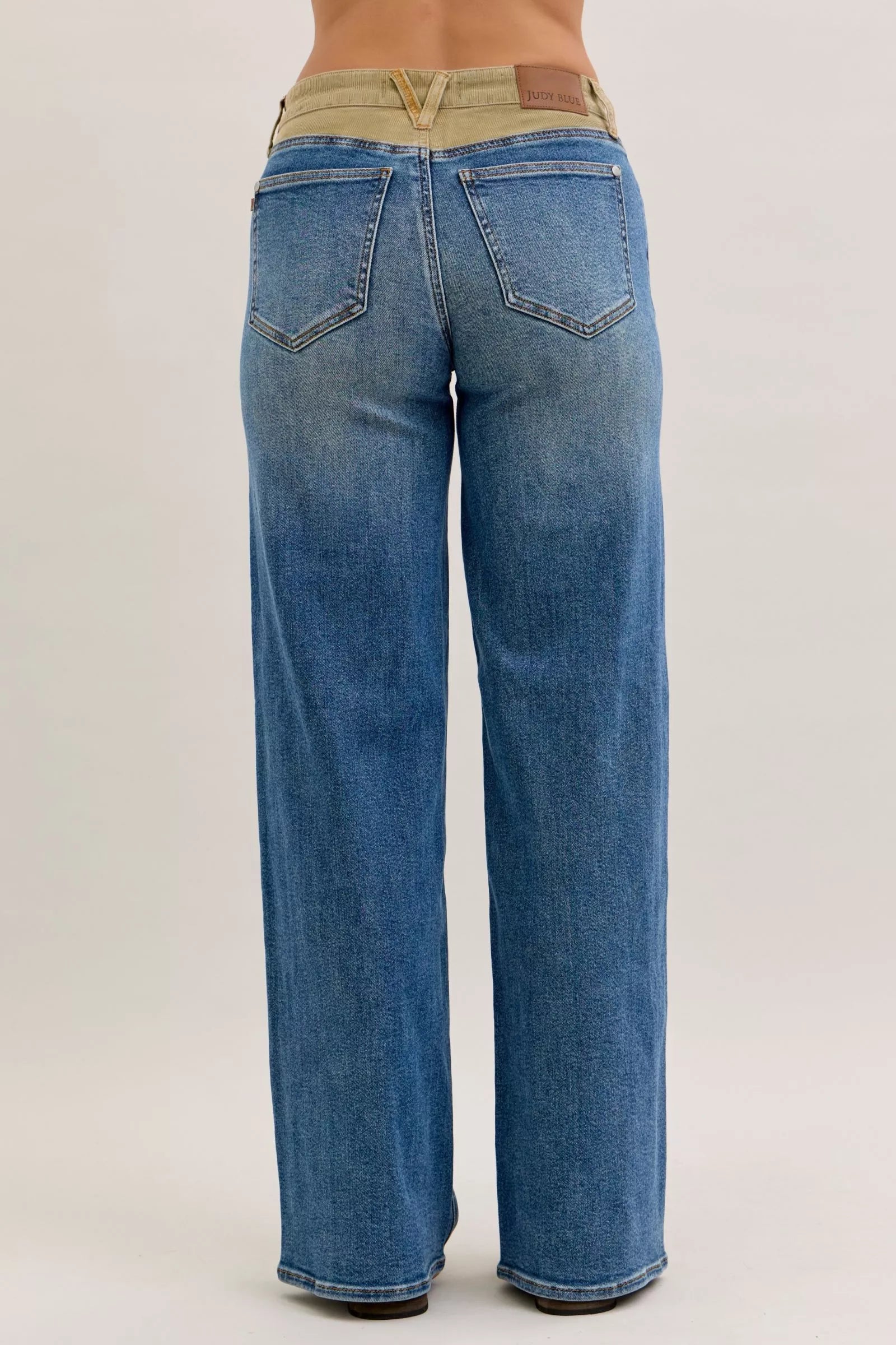 Judy Blue mid-rise straight jeans back: blue denim, beige waistband, brown leather patch