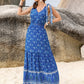 Vibrant blue printed V-neck tie shoulder maxi dress with white hem patterns