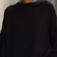 Black oversized batwing sleeve knit sweater with ribbed crew neck