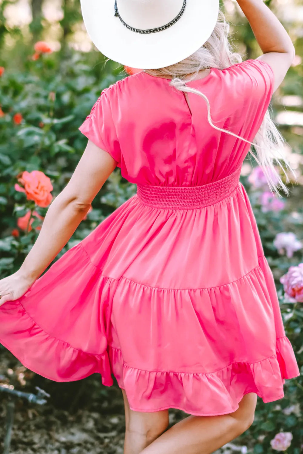Vibrant pink smocked V-neck cap sleeve mini dress
