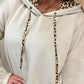 Beige long sleeve hoodie with leopard trim hood lining and drawstrings