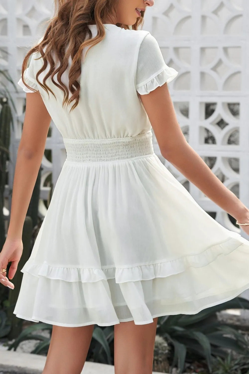 Tie-front mini dress in flowing white chiffon with smocked waist