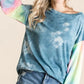 BiBi tie-dye French terry top with bell sleeves and distressed denim shorts