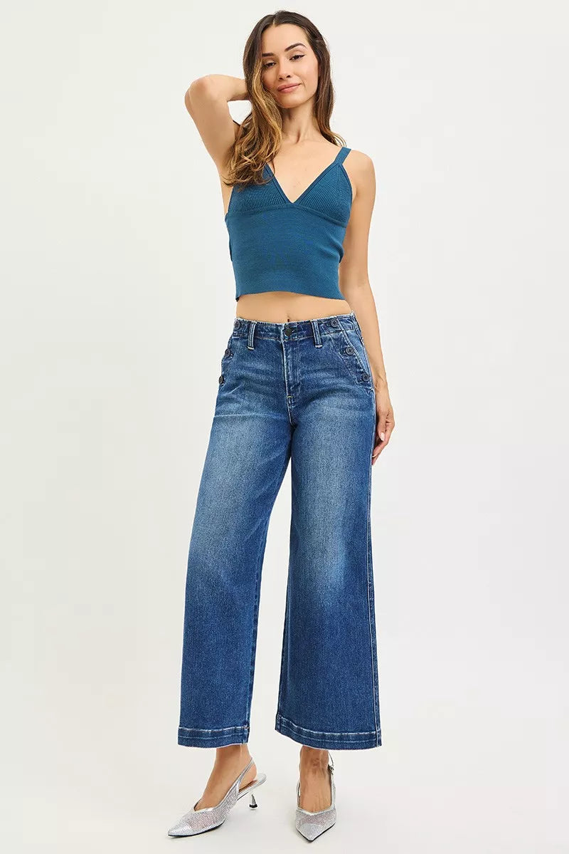 Woman in RISEN high-rise wide-leg jeans with teal cropped knit top