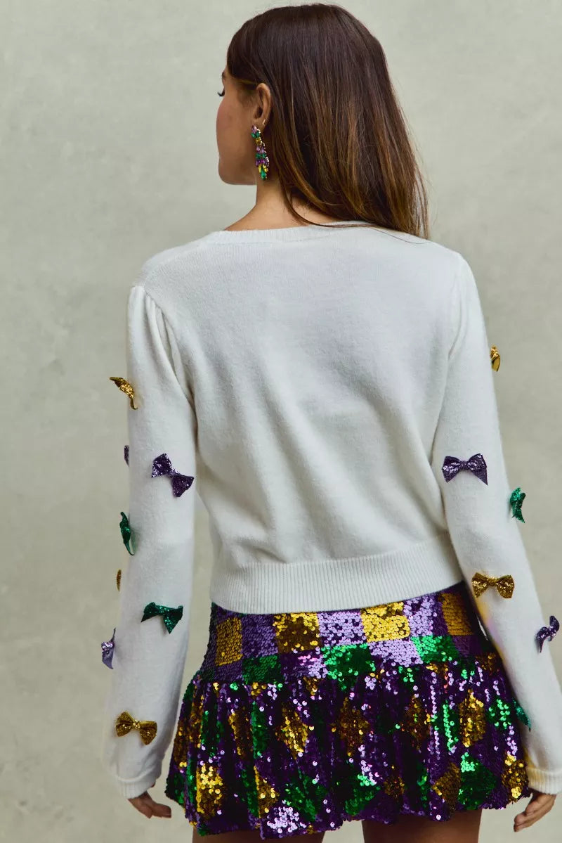 White SO ME Mardi Gras glitter bow knit sweater with colorful sequins