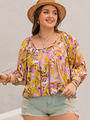 Plus size printed tie neck blouse in vibrant floral hues