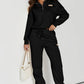 Daverri black zip-front sweatshirt with beige chest patch and drawstring pants