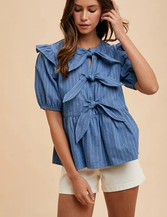 MEDIUM DENIM Annie Wear Stripe Front Bow Denim Peplum Blouse | Daverri Fashions
