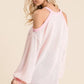 BiBi Popcorn waffle top in soft off-white with pink trim and cold shoulder cutouts