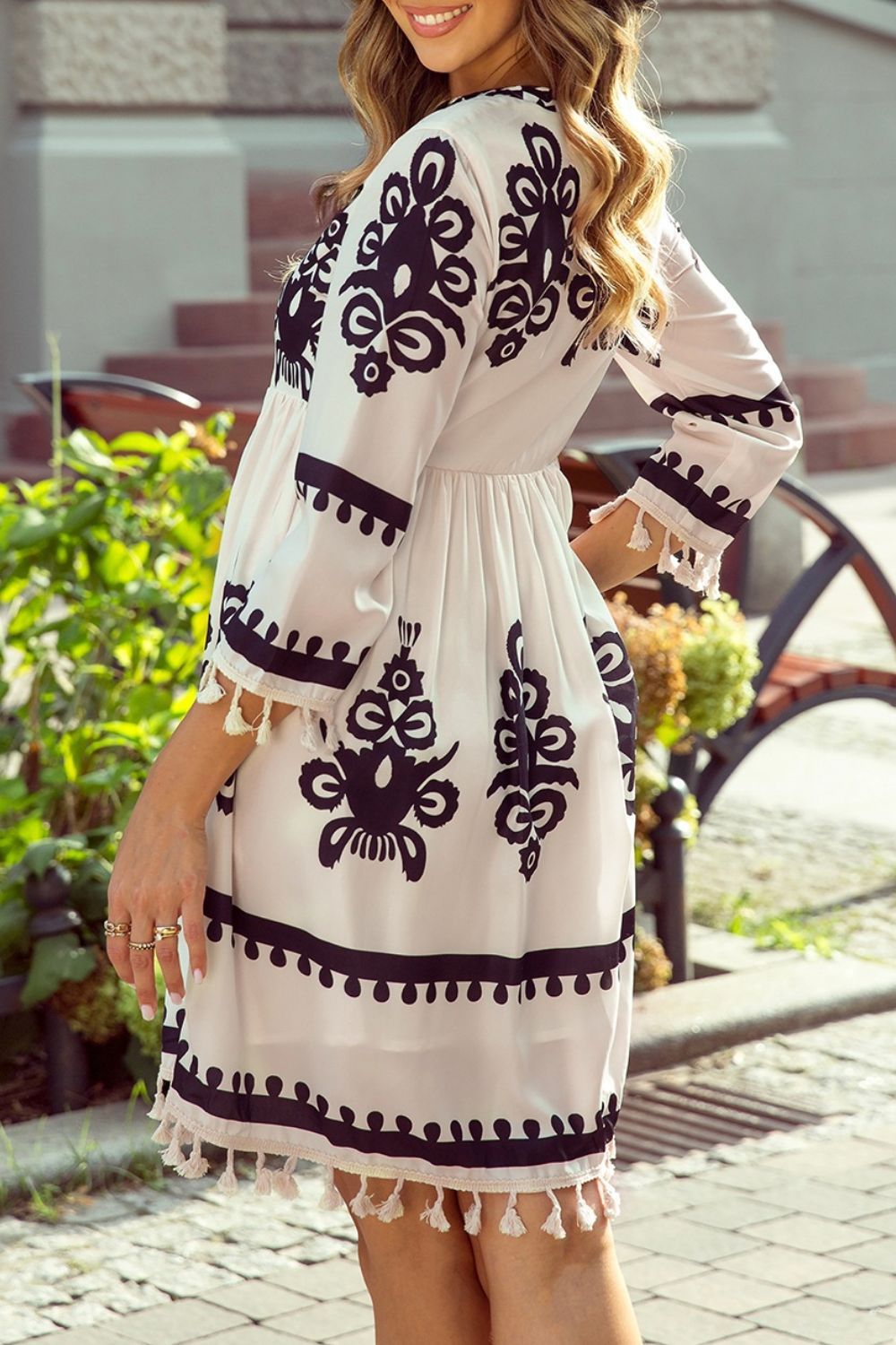 Tassel hem 3/4 sleeve mini dress with black floral embroidery