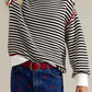 Striped round neck long sleeve sweater in black and white with red trim