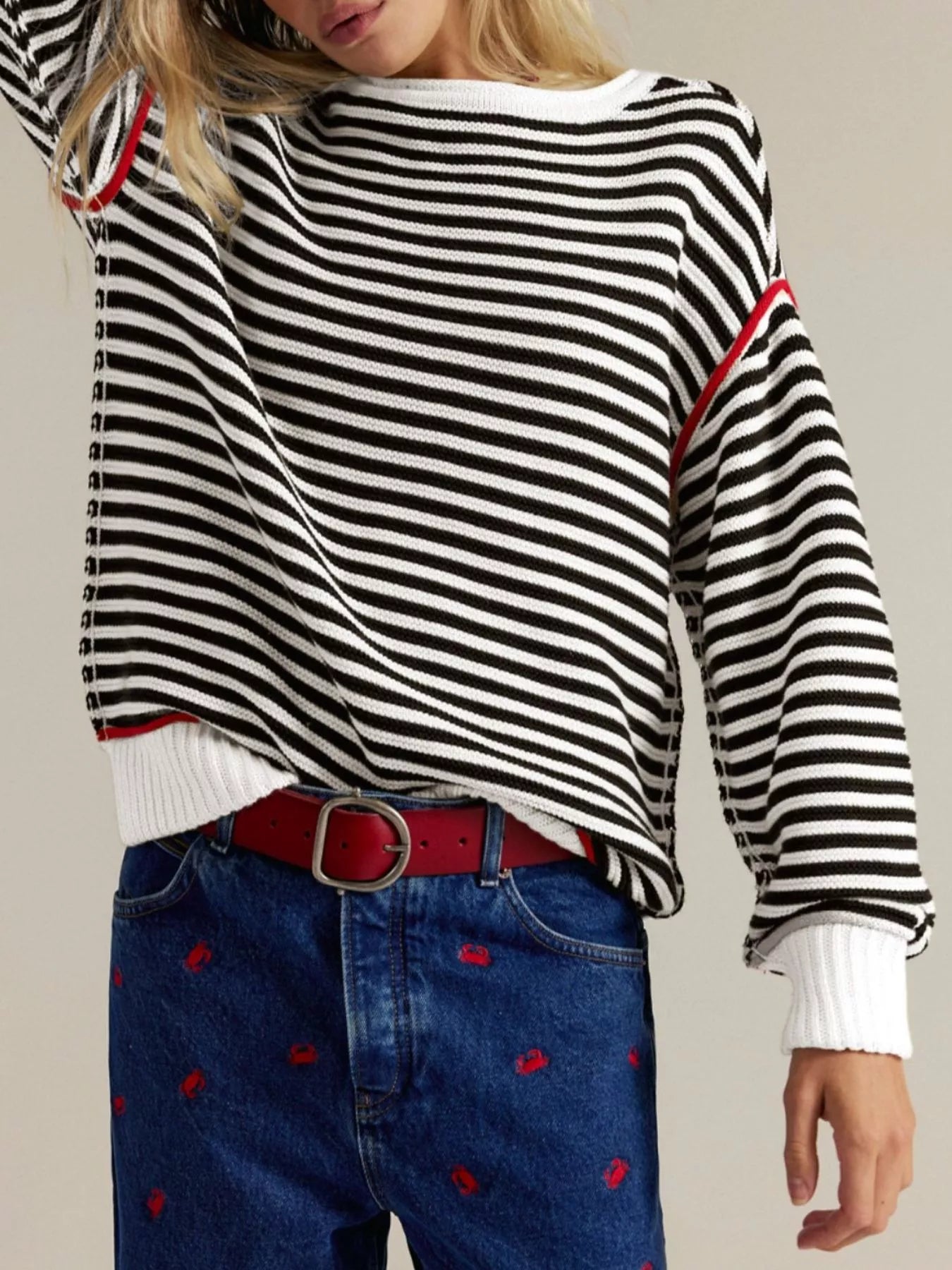 Striped round neck long sleeve sweater in black and white with red trim