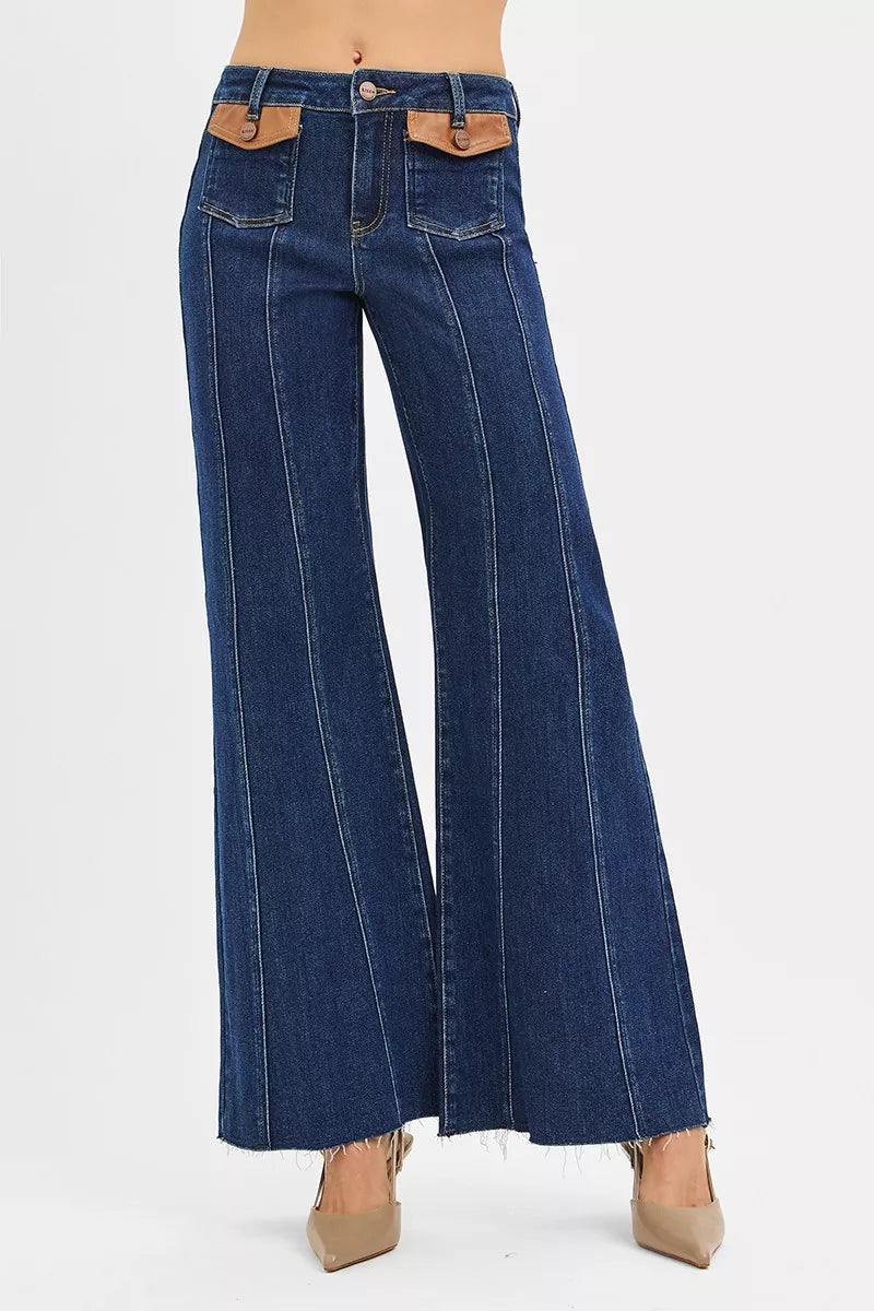 Dark blue Risen high rise wide flare jeans with tan leather flap pockets